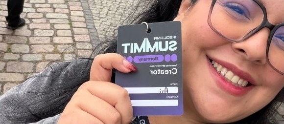 Ari holding her Solana Summit Germany creator badge
